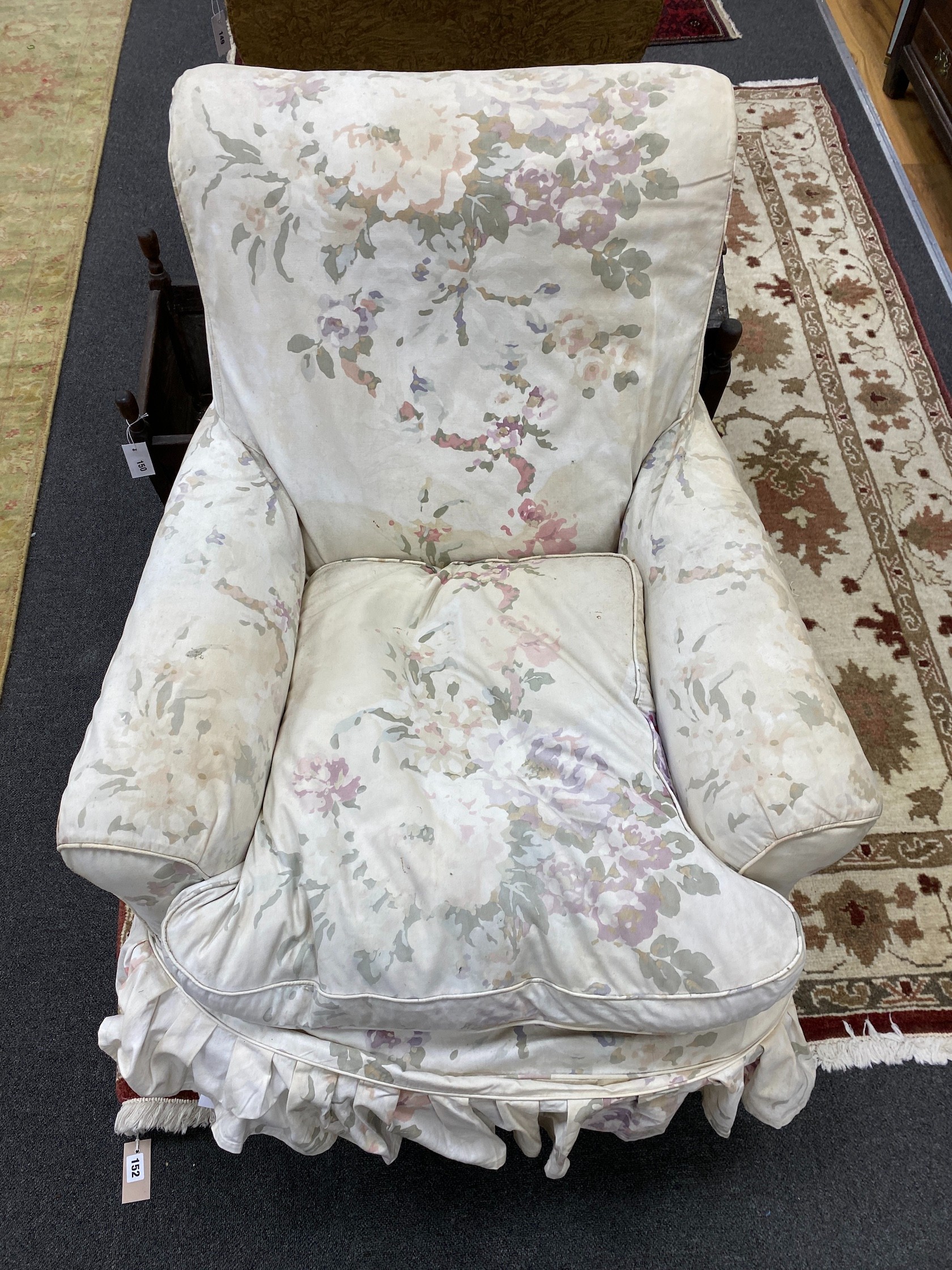 A Victorian mahogany armchair, upholstered faded beige foliate fabric, width 82cm, depth 80cm, height 86cm